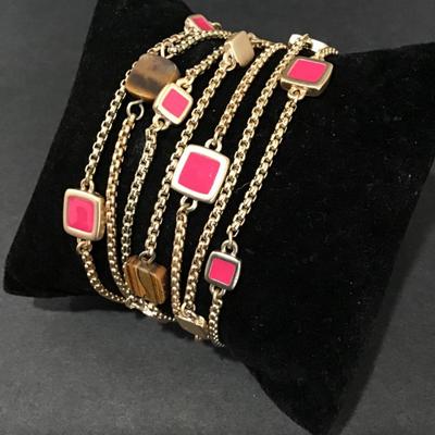 Satin gold, toned, pink and tigers eye. Magnetic clasp bracelet. Very nice.