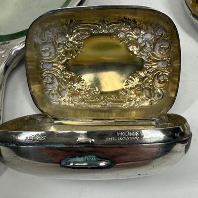 Sale Photo Thumbnail #77: Hand mirror, brushes, nail buffer, dresser Jar, Soap Box.  fair to good condition - there are dings and dents, and some deterioration of nail buffer pad, mirror clarity which is normal for the age of the pieces.. See photos for condition. All pieces are m