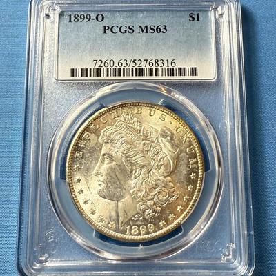 PCGS CERTIFIED 1899-O MS63 GRADED MORGAN SILVER DOLLAR AS PICTURED. (COIN #8316).