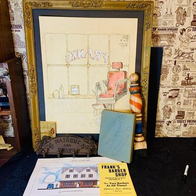 LOT 91: Barber Shop Memorabilia a Framed Etching, Cast Iron Haircut Plaque, Wooden Barber Poll, Books and Mor