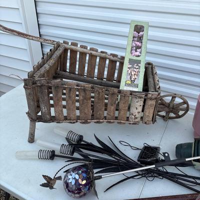 Outdoor group includes candles and Wood wheelbarrow