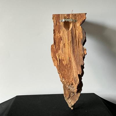 First Nations Woman Carved from Wood wall art