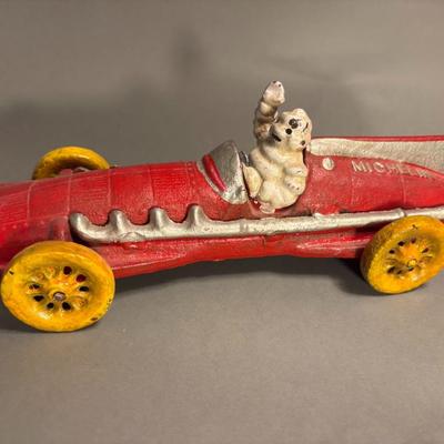 Antique Michelin Man Driving Figurine Red Car