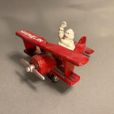Antique Michelin Man Flying Figurine Red Airplane