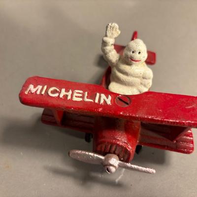 Antique Michelin Man Flying Figurine Red Airplane