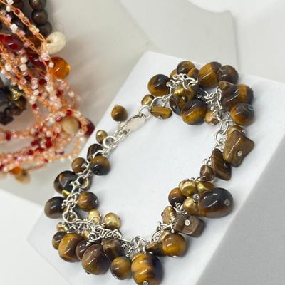 LOT 164J: Triple Strand Tiger Eye Necklace, Puka Shell Necklace, Tiger Eye Sterling Bracelet and More!