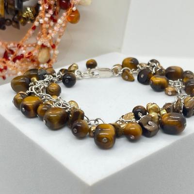 LOT 164J: Triple Strand Tiger Eye Necklace, Puka Shell Necklace, Tiger Eye Sterling Bracelet and More!