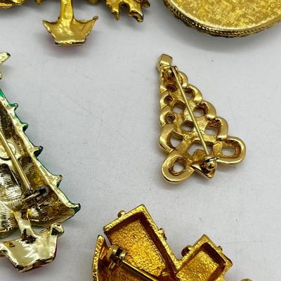 LOT: 191J: Christmas Brooch Lot: Avon, AJMC and More