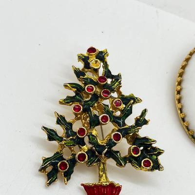 LOT: 191J: Christmas Brooch Lot: Avon, AJMC and More
