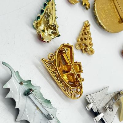 LOT: 191J: Christmas Brooch Lot: Avon, AJMC and More