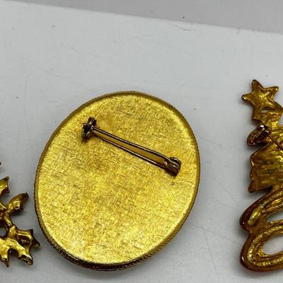 LOT: 191J: Christmas Brooch Lot: Avon, AJMC and More