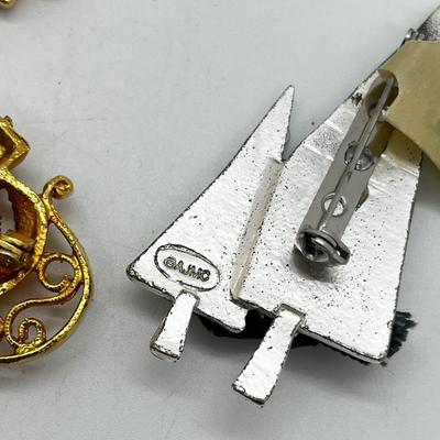 LOT: 191J: Christmas Brooch Lot: Avon, AJMC and More