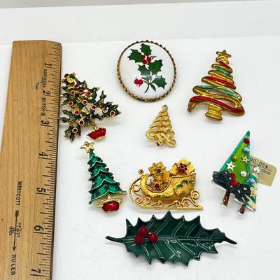 LOT: 191J: Christmas Brooch Lot: Avon, AJMC and More