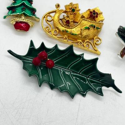 LOT: 191J: Christmas Brooch Lot: Avon, AJMC and More