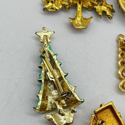 LOT: 191J: Christmas Brooch Lot: Avon, AJMC and More