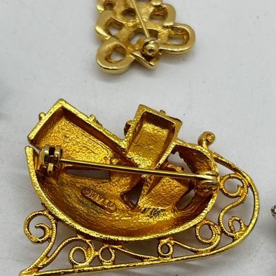 LOT: 191J: Christmas Brooch Lot: Avon, AJMC and More