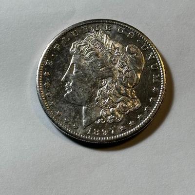1897-S UNCIRCULATED/MS60 GRADE CLEANED MORGAN SILVER DOLLAR AS PICTURED.