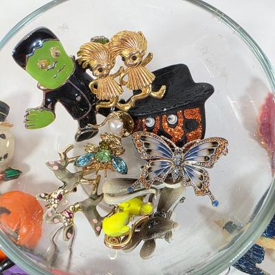 LOT 98D: Collection Of Vintage Costume Jewelry, Includes Holiday Themed Pins, Earrings & A Clear Glass Bowl W/Lid