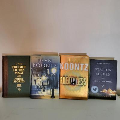LOT 110: Seventeen Assorted Fiction Books Featuring Dean Koontz and More