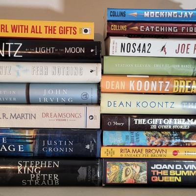 LOT 110: Seventeen Assorted Fiction Books Featuring Dean Koontz and More