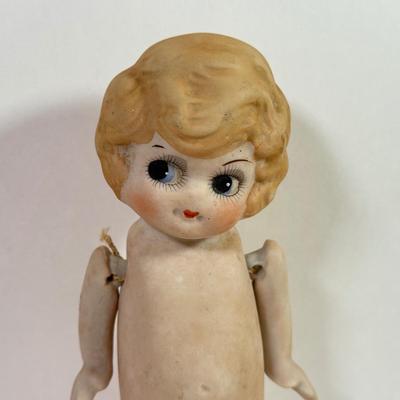 LOT 146L: 1960s Elephant One Man Band Wind Up Toy, Vintage Ceramic Doll made in Japan & Composite Mini Doll