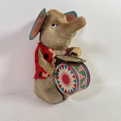 LOT 146L: 1960s Elephant One Man Band Wind Up Toy, Vintage Ceramic Doll made in Japan & Composite Mini Doll