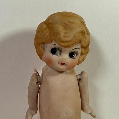 LOT 146L: 1960s Elephant One Man Band Wind Up Toy, Vintage Ceramic Doll made in Japan & Composite Mini Doll