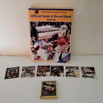 LOT 156: Fifteen Various Paperback Hockey Books and Hockey/Baseball Trading Cards