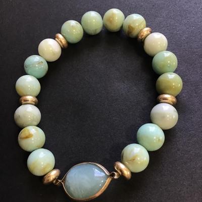 Teal colored beaded stretch bracelet with faux stone