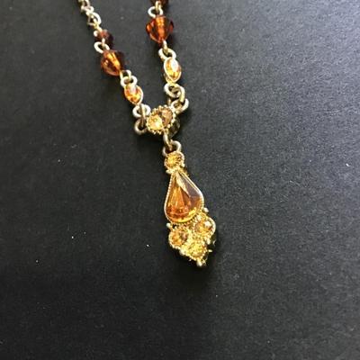 Silver tone amber colored beaded necklace