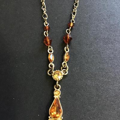 Silver tone amber colored beaded necklace