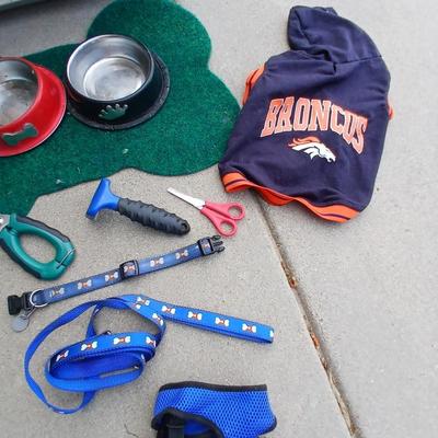 Dog carrier with an assortment of dog supplies - Bowls- clothes - leashed and more