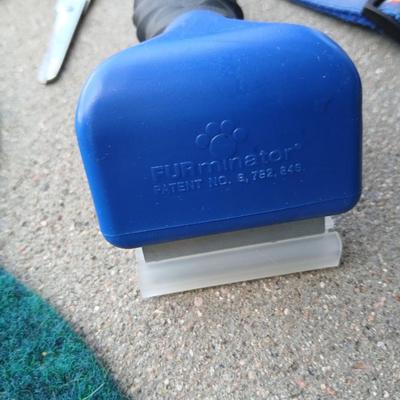 Dog carrier with an assortment of dog supplies - Bowls- clothes - leashed and more