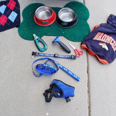 Dog carrier with an assortment of dog supplies - Bowls- clothes - leashed and more
