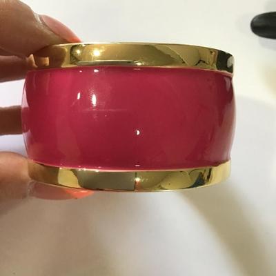 Large, chunky gold, toned, pink enamel hinged bracelet