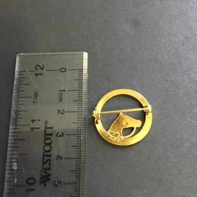 Gold tone horse brooch