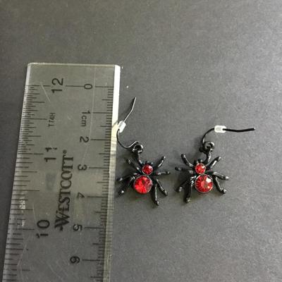 Black spider dangle earrings with red rhinestones