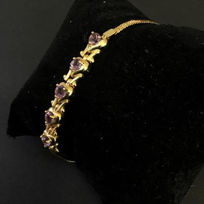 Beautiful, gold, toned, purple rhinestone bracelet