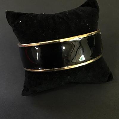 Large chunky gold, toned, black enamel, hinged, magnetic bangle bracelet