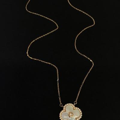 Beautiful very nice gold toned mother of pearl, dainty crystal rhinestone flower necklace