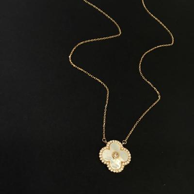 Beautiful very nice gold toned mother of pearl, dainty crystal rhinestone flower necklace