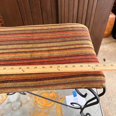 Cushion topped iron bench