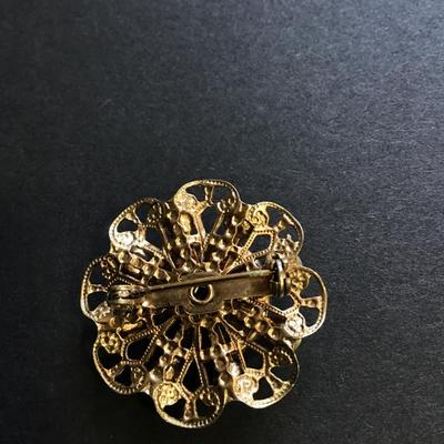 Gold tone flower brooch