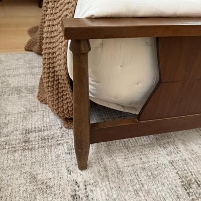 Sale Photo Thumbnail #18: The Stanley platform bed is designed for a twin mattress and crafted from pine wood, featuring a slatted foundation for support. It comes in a walnut finish with a mid-century modern style, suitable for adult bedrooms. Assembly is required, but no additio