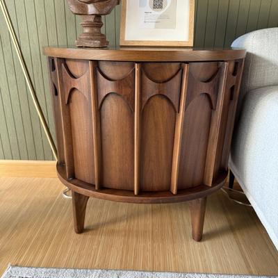 Sale Photo Thumbnail #22: This Kent Coffey nightstand from the Perspecta line is a mid-century modern piece crafted from walnut, featuring a medium wood tone and a single drawer for storage. Measuring 25 inches in height, 25 inches in width, and 17 inches in length, it is fully as