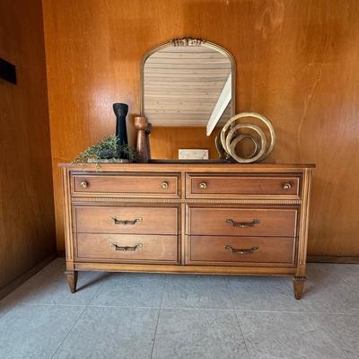Sale Photo Thumbnail #27: The Dixie dresser is a mid-century modern piece crafted from solid wood, featuring a rich brown color and original finish. It measures 54 inches in length, 18 inches in width, and 30 inches in height, with four drawers providing ample storage for bedroom 