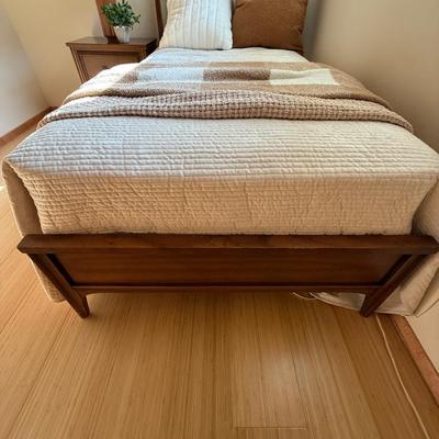 Sale Photo Thumbnail #29: This Kent Coffey headboard is a full-size piece crafted from walnut and rosewood, showcasing a Mid Century Modern style with elegant curved detailing. It is an original piece from the mid-20th century, designed for adults. The headboard features an authen