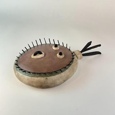 Sale Photo Thumbnail #1088: Depicting a face expression with a head feather
Measurements:
9" in height, 5" in width