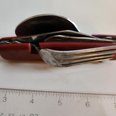 Sale Photo Thumbnail #120: This auction lot is for a Field Gear Dining/Kitchen Knife.  This Knife has a blade, a fork, a spoon, a can/bottle opener and a corkscrew.  Almost a cutlery drawer in a folding knife,  Ready for your next big hike or camp out.  See photos for sizing.