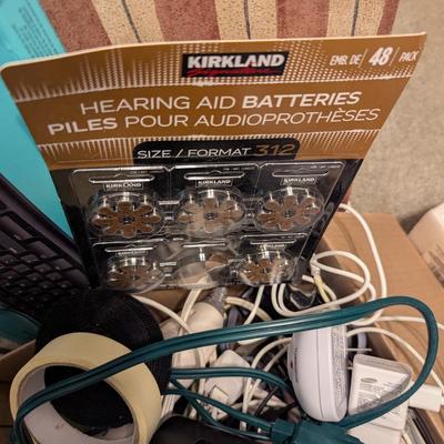 Assortment Of Cords Lights Batteries Logitech Keyboard